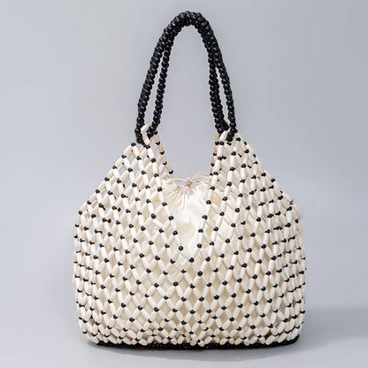 Resort Aesthetics: Chic Pearl Handle Beaded Bag