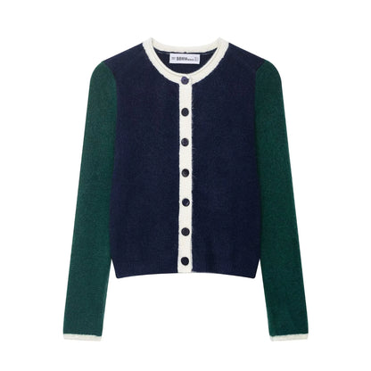 Two-tone cardigan with green sleeves and navy body on a white background