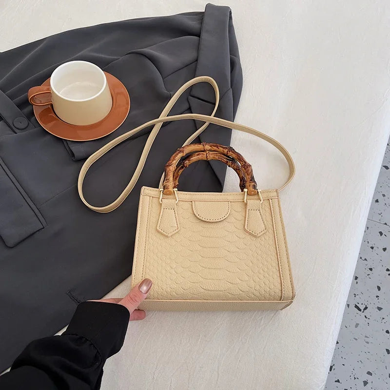 Artisanal Detail: Textured Bamboo-Handle Structured Bag