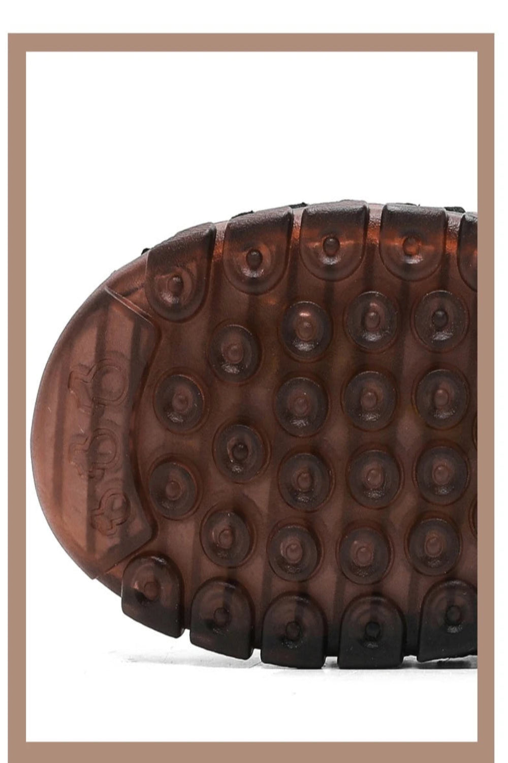 Close-up of a brown shoe sole with a textured pattern on a white background