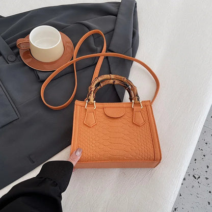 Artisanal Detail: Textured Bamboo-Handle Structured Bag