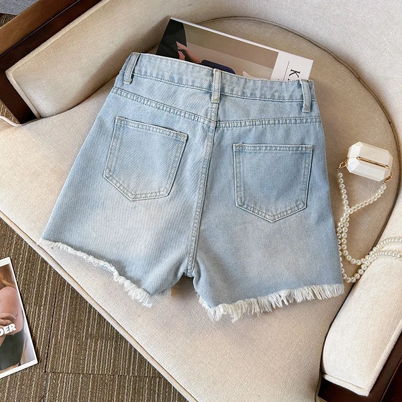 Effortless Summer Styling: Distressed High-Waist Button-Fly Denim Shorts