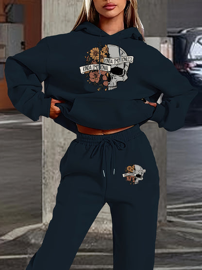 Person wearing a navy blue hoodie and jogger set with graphic designs.