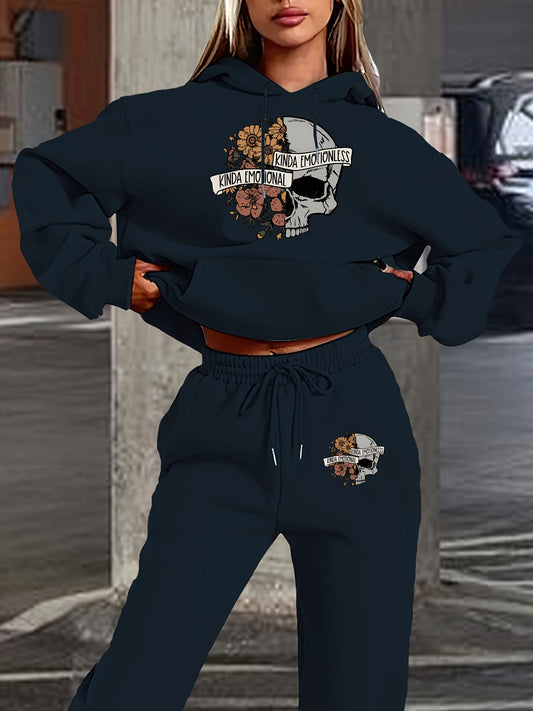 Person wearing a navy blue hoodie and jogger set with graphic designs.