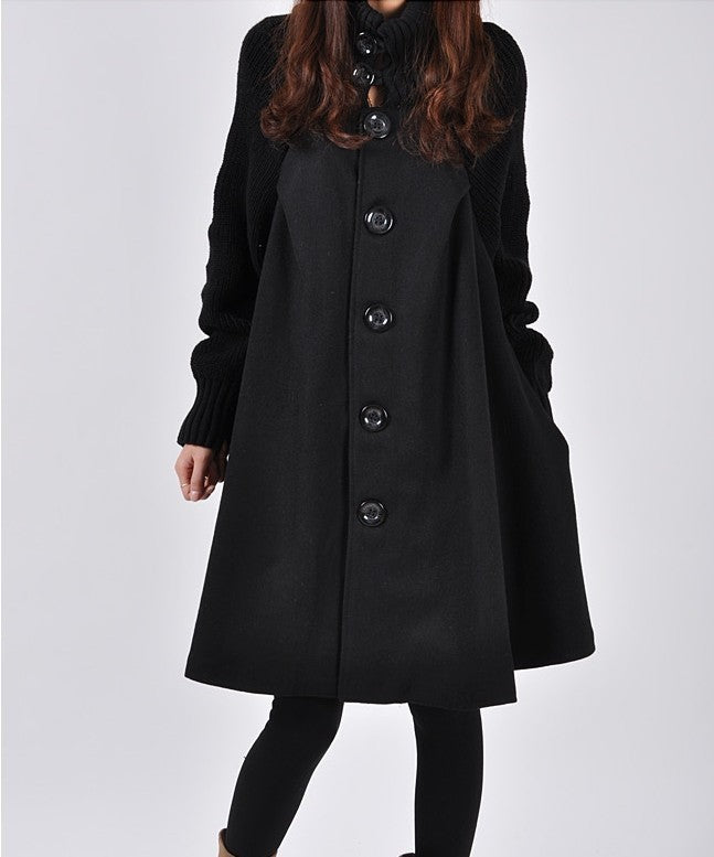 Black coat with button details on a white background