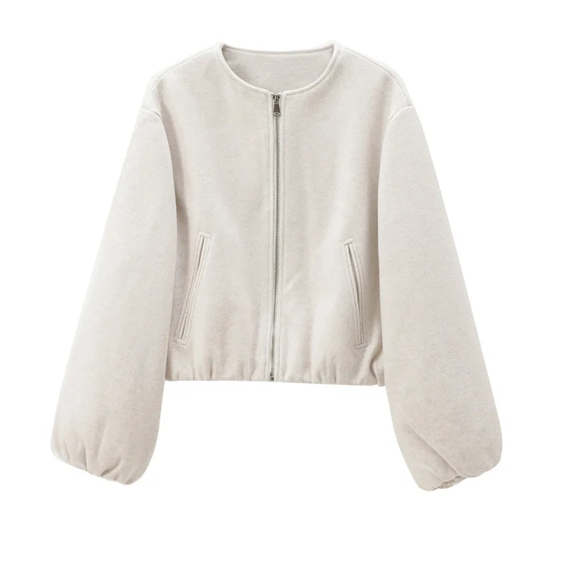 Beige zip-up jacket on a white background