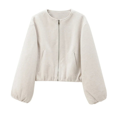 Beige zip-up jacket on a white background