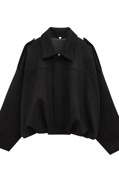 Black shirt with a collar on a white background