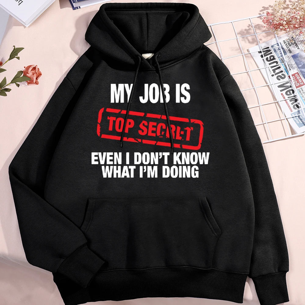 Black hoodie with humorous text design on a light background