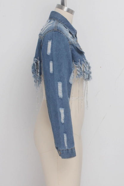 Distressed denim jacket on a mannequin against a white background