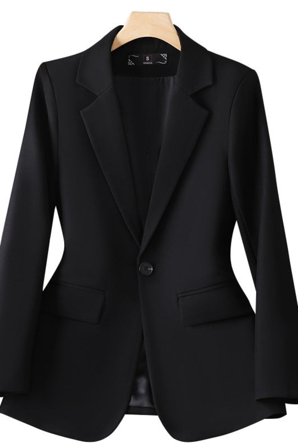 Black blazer on a mannequin against a white background