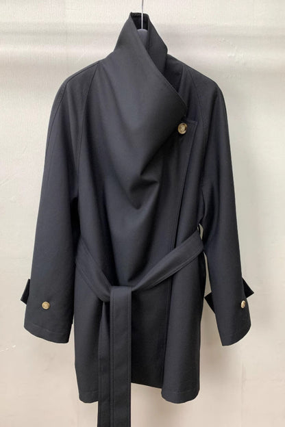 Dark gray coat with gold buttons on a white background