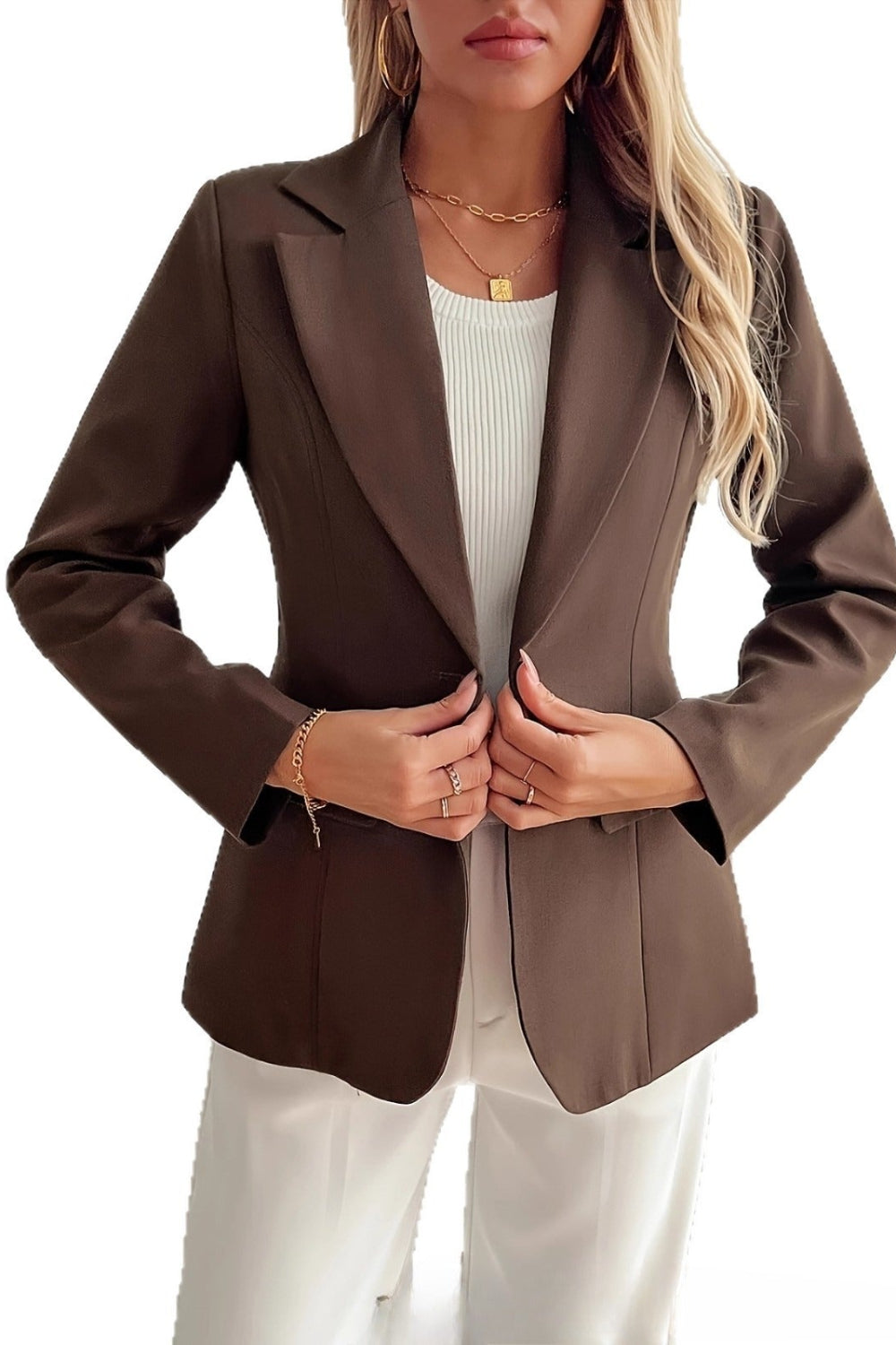 Brown blazer worn by a person on a white background