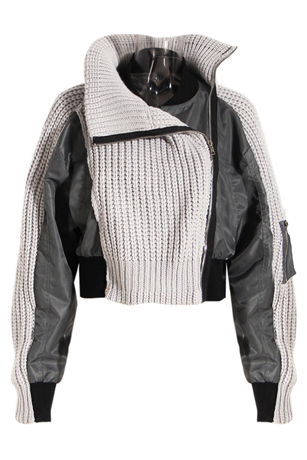 Two-tone jacket with knitted sleeves and black accents on a white background