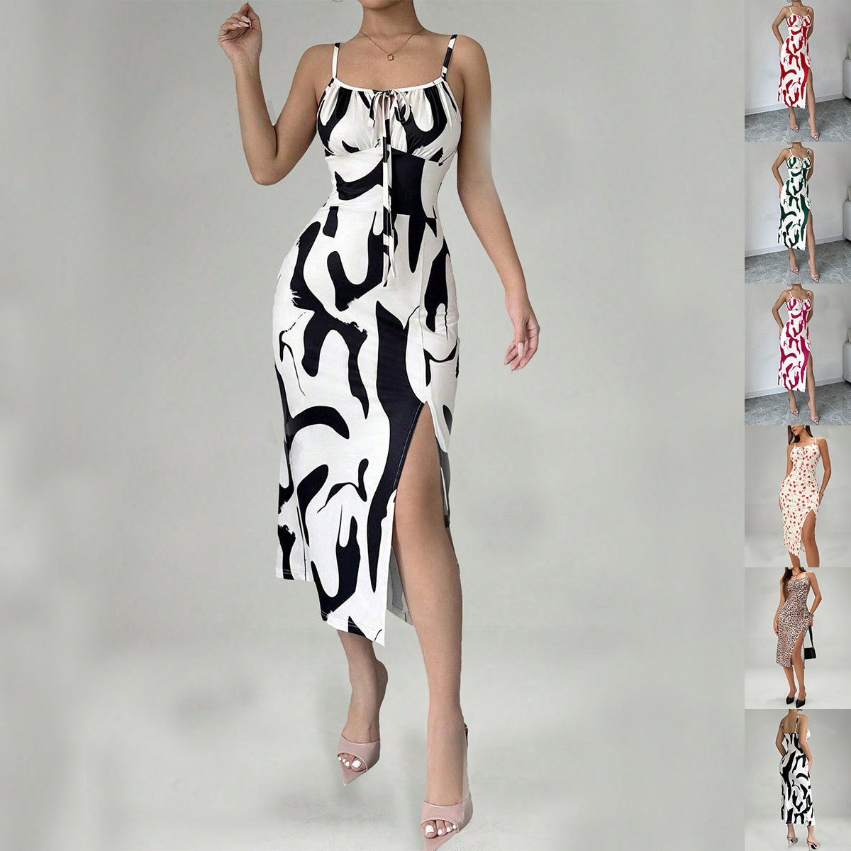 Black and white patterned dress with a high slit on a gray background