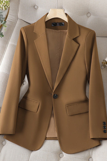 Brown blazer on a hanger against a neutral background