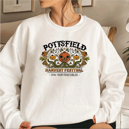 Person wearing a white sweatshirt with 'Pottsfield Harvest Festival' design.