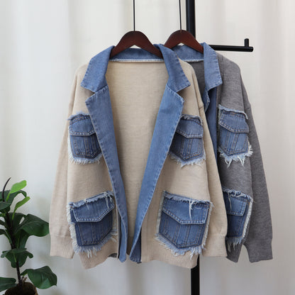 Denim jacket with patchwork design on a mannequin against a white background