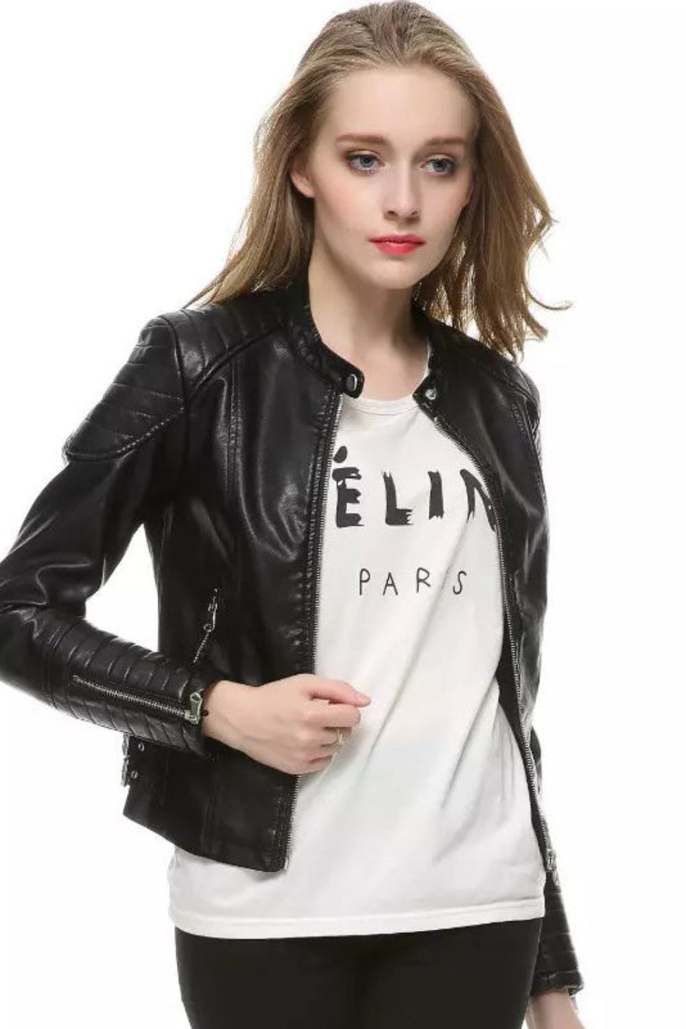 Woman wearing a black leather jacket over a white graphic t-shirt on a white background