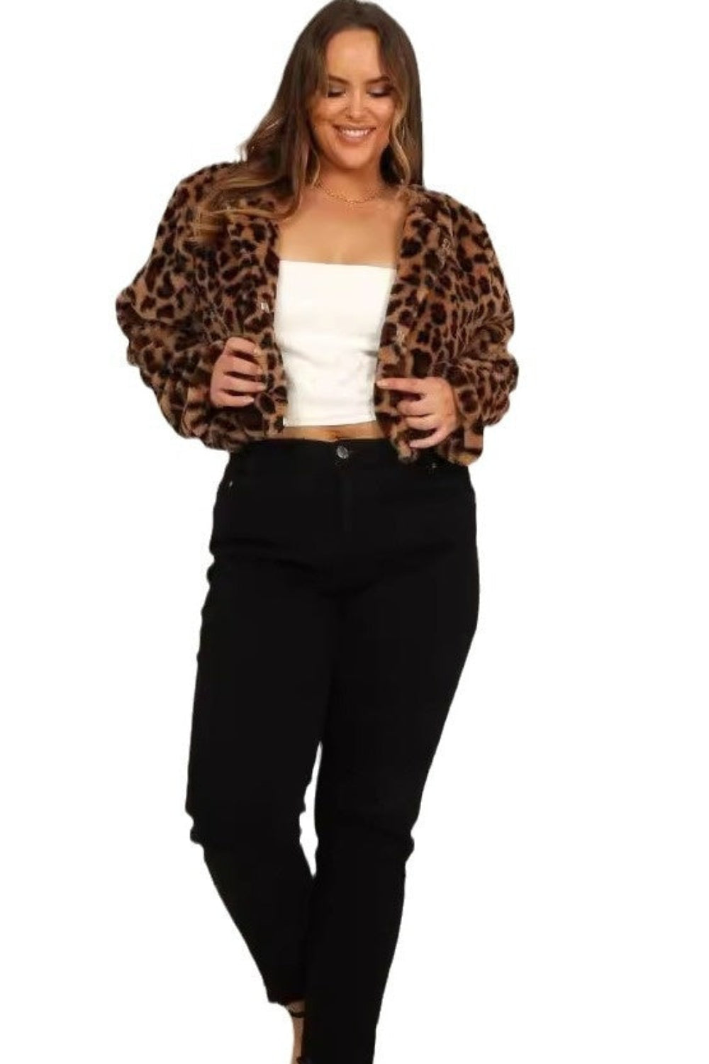 Woman wearing a leopard print jacket, white top, and black pants on a white background